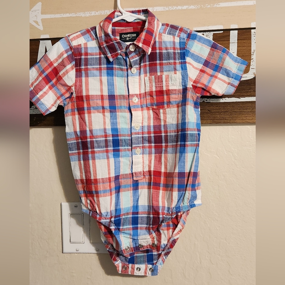 OSHKOSH 24 MONTHS RED, WHITE, AND BLUE SHIRT THAT BUTTONS IN THE BOTTOM.